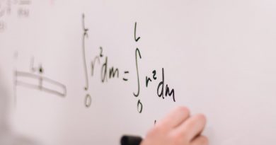 person writing on white board